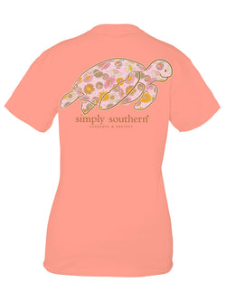 Cocktail orange SS shirt with a disco and flower patterned sea turtle and the phrase 'Conserve and Protect'. Turtle tracker.